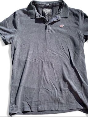 Hollister navy blue Men's Polo with red logo